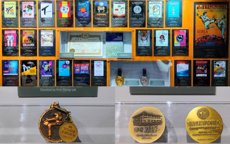 The exhibition features posters from the World Taekwondo Championships (1973-2023) and commemorating medals marking Taekwondo’s recognition as an official sport at both the 1986 Seoul Asian Games and the 2000 Sydney Olympic Games. 