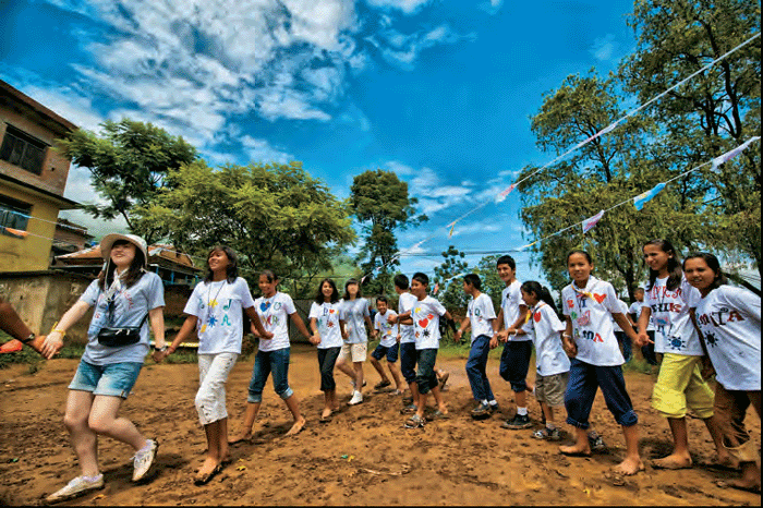 South Koreans serve the world as members of the international community through international cooperation carried out at the government level and through private organizations’ voluntary activities. (Photo: South Korean COPION volunteers with locals in Kathmandu, Nepal)