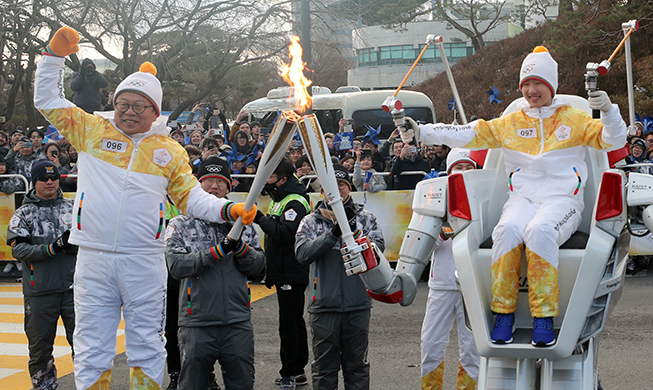 Robot carries Olympic flame