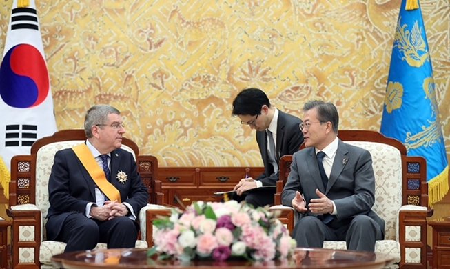 President Moon honors IOC chief