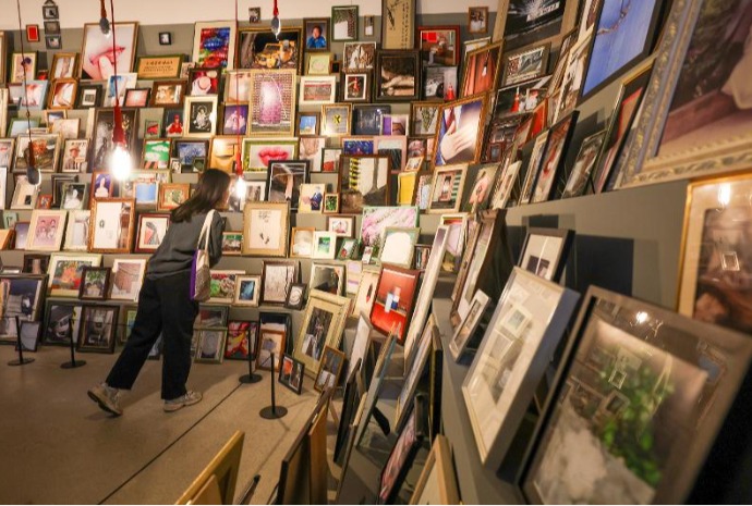 Frames in stacked tiers with piles of memories
