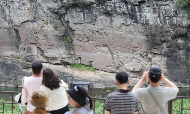 Prehistoric images carved on rocks named UNESCO World Heritage